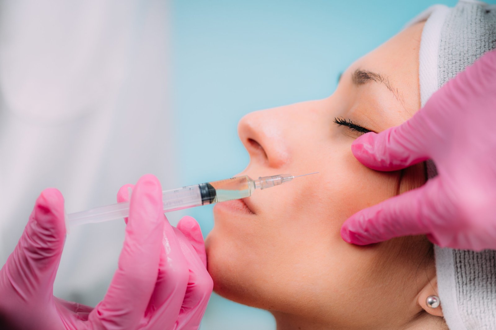 woman getting an injection in her cheek